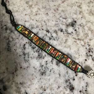 Beaded bracelet with black cord